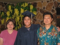Jirayuth Latthivongskorn, a DACA recipient, posed with his parents at a high school graduation.