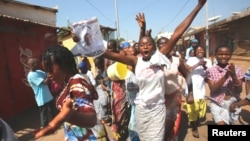 Supporters of President-elect Adama Barrow celebrate his election victory in Banjul, Gambia, Dec. 2, 2016. 