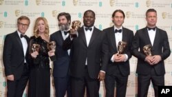From left, Christoph Waltz, Dede Gardner, Anthony Katagas, Steve McQueen, Jeremy Kleiner and Brad Pitt pose with their awards for best film for 12 Years A Slave in the winners room at the EE British Academy Film Awards held at the Royal Opera House on Sun