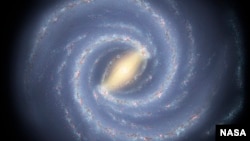 FILE - An artist's rendition of the Milky Way. Akshay Suresh, a Cornell University graduate student in astronomy, says aliens may use radar-like pulses for galaxy-wide communications, "for which the core of the Milky Way is ideally placed."
