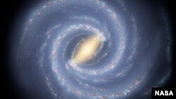 FILE - An artist's rendition of the Milky Way. Akshay Suresh, a Cornell University graduate student in astronomy, says aliens may use radar-like pulses for galaxy-wide communications, "for which the core of the Milky Way is ideally placed."