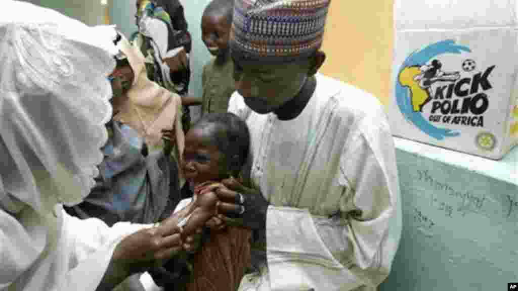 A child cries as she is immunized against polio in Kano, Nigeria.