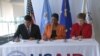 From left to right: USAID Administrator Rajiv Shah, UN Emergency Relief Coordinator Valerie Amos and EU Humanitarian Commissioner Kristalina Georgieva sign a "call to action" aimed at averting famine in South Sudan, in Washington on Sat. April 12, 2014.