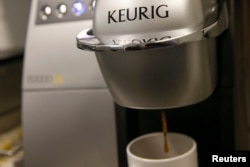 A single-serve Keurig Green Mountain brewing machine dispenses coffee in New York, Feb. 6, 2015.