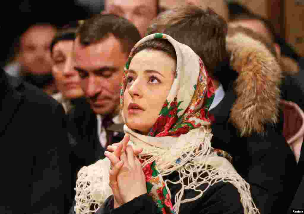 Worshipers attend a service marking Orthodox Christmas and celebrating the independence of the Orthodox Church of Ukraine at the Saint Sophia&#39;s Cathedral in Kyiv, Ukraine.