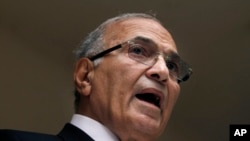 FILE - In this May 26, 2012, photo, Egyptian presidential candidate Ahmed Shafiq speaks to the media during a press conference at his office in Cairo, Egypt.