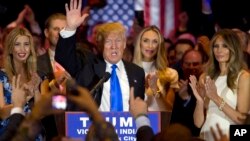 FILE - Republican presidential candidate Donald Trump is joined by his wife Melania, right, and daughter Ivanka, left, as he speaks during a primary night news conference, May 3, 2016.