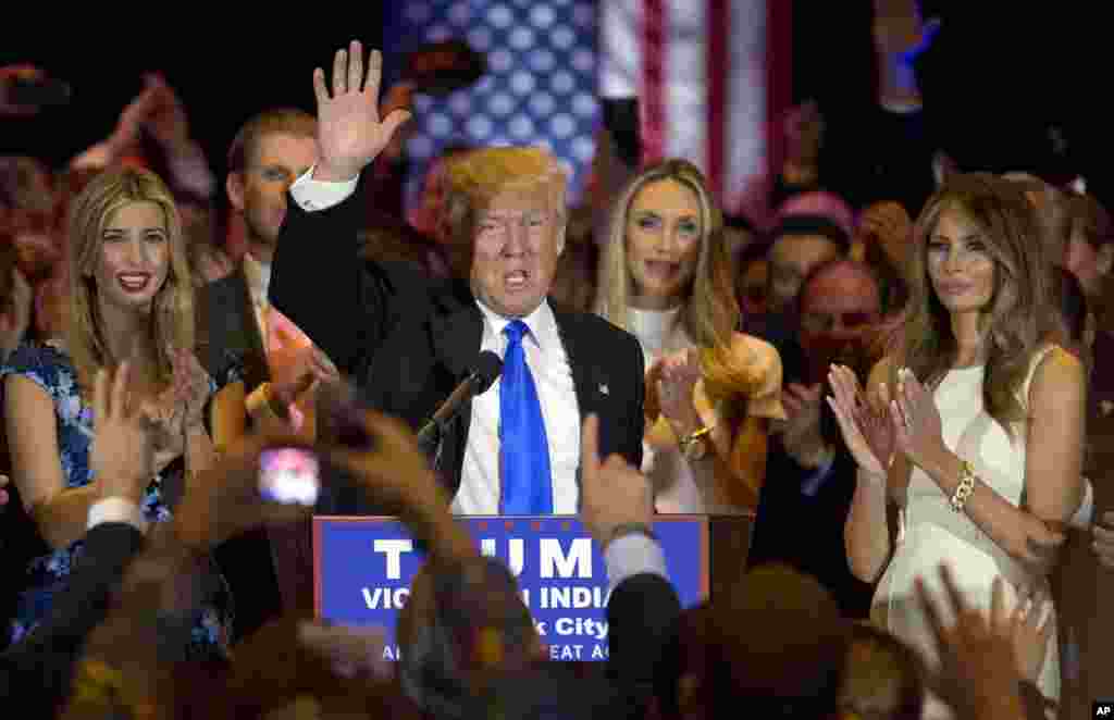 Republican presidential candidate Donald Trump is joined by his wife Melania, right, daughter Ivanka, left, as he speaks during a primary night news conference, Tuesday, May 3, 2016.