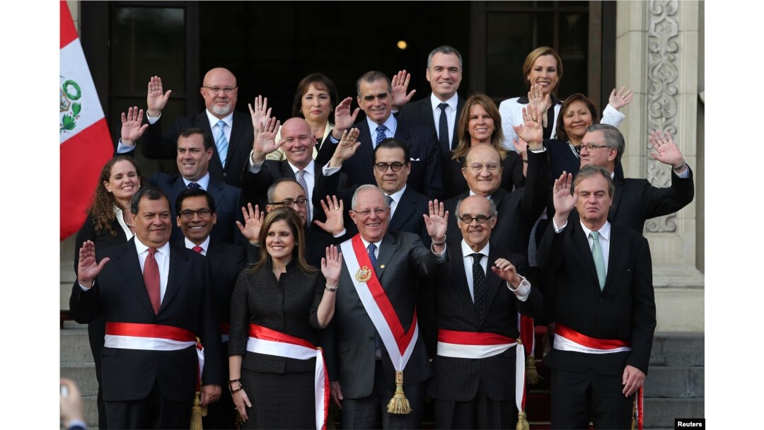 FILE - Peru's President Pedro Pablo Kuczynski (C) poses with newly sworn-in ministers after a ceremony at the government palace in Lima, Sept. 17, 2017.