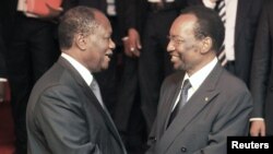 Ivory Coast President Alassane Ouattara (L) greets Dioncounda Traore, Acting President of Mali, after an extraordinary summit of West African regional bloc ECOWAS on the crisis in Mali, Abidjan, January 19, 2013. 