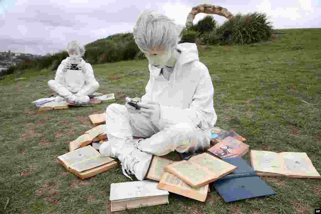 An installation called "Quotidianity the brothers" is displayed along the coastline in Sydney, Thursday, Oct. 22, 2015, as part of the annual Sculpture by the Sea exhibition. 