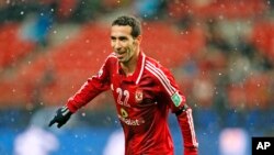 FILE - Mohamed Aboutrika celebrates after scoring a goal during a quarterfinal at the FIFA Club World Cup soccer tournament in Japan, Dec. 9, 2012.