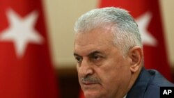 Le Premier ministre turc Binali Yildirim à Ankara, en Turquie, le lundi 18 Juillet 2016, après le coup d'Etat manqué contre le président turc, Recep Tayyip Erdogan. Son gouvernement a vite agi pour consolider son pouvoir et supprimer ceux qui sont perçus des ennemis. (Hakan Goktepe, Premier Ministre Service de presse, Pool)