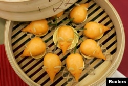 FILE - New Year radish cakes made in the shape of mice for the Lunar Year of the Rat in 2008. REUTERS/Bobby Yip