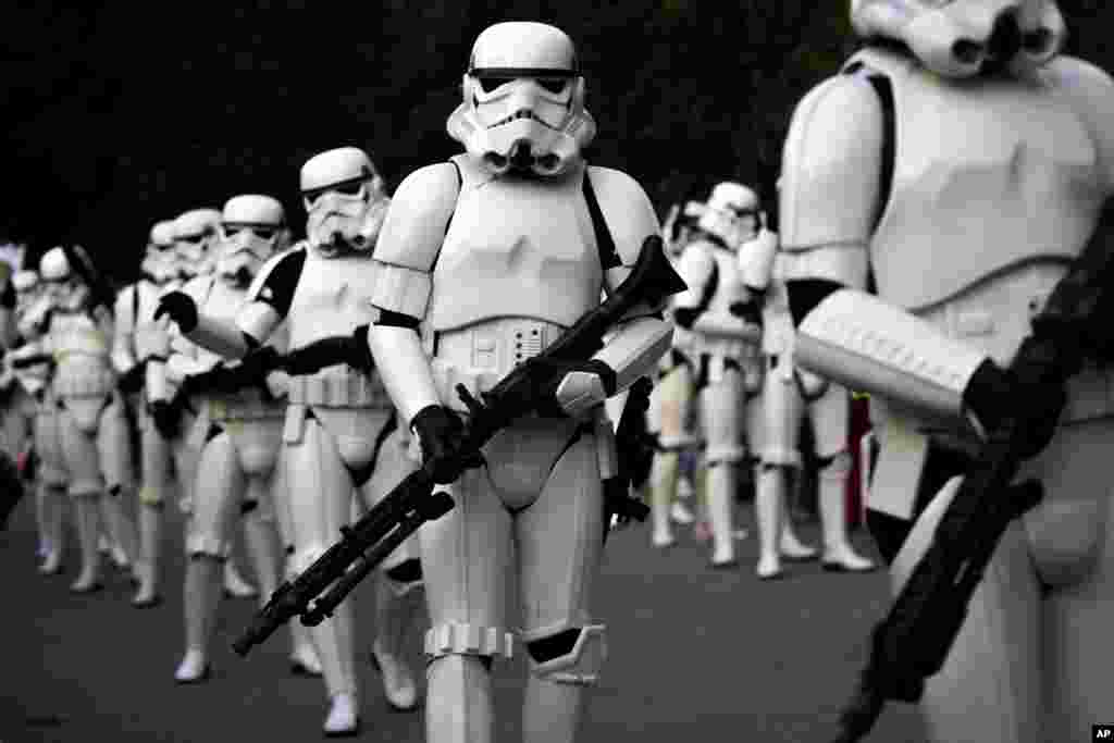 Revelers dressed as stormtroopers of the Galactic Empire march during a Star Wars Parade in Madrid, Spain, Sept. 20, 2014.