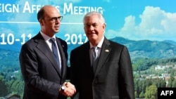 Italy's Foreign Minister Angelino Alfano (L) welcomes US Secretary of State Rex Tillerson as he arrives for a meeting of Foreign Affairs Ministers from the Group of Seven (G7) industrialised countries on April 10, 2017 in Lucca, Tuscany. Italy's Foreign 
