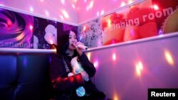 Japanese Yuuka Hasumi, 17, who wants to become a K-pop star, sings a song as she spends time after class, in the Hongdae area of Seoul, South Korea, April 3, 2019. 