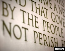FILE - A line from Abraham Lincoln's Gettysburg Address is displayed at the Lincoln Memorial in Washington.
