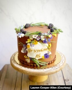 Baker, food stylist and photographer Lauren Cooper Allen uses edible flowers, such as violets, on her cakes and other baked treats. In this photo, she used pansies on a birthday cake.(Photo by Lauren Cooper Allen)