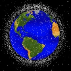 This computer image of Earth shows orbiting layers of space junk being observed by NASA