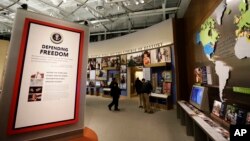 Displays on presidential policy are seen during a tour of the George W. Bush Presidential Center in Dallas, Texas, April 24, 2013.