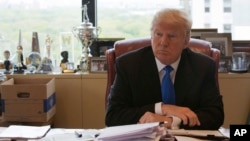 FILE - Republican presidential candidate Donald Trump is photographed during an interview in his office at Trump Tower in New York, May 10, 2016.