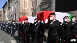 FILE: This photo taken on February 25, 2021 shows police officers carrying the coffins of slain Italian Ambassador Luca Attanasio and Italian Carabinieri police officer Vittorio Iacovacci , in Rome, after their state funerals.