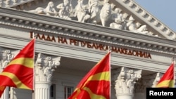 National Macedonian flags flutter in front of the government building in Skopje, Macedonia, June 12, 2018. 