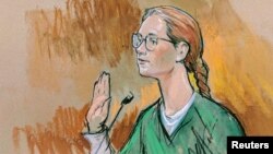 Accused Russian agent Maria Butina pleads guilty to a single conspiracy charge in a deal with prosecutors and admitted to working with a top Russian official to infiltrate a powerful gun-rights group and influence U.S. policy toward Moscow, in Washington, Dec. 13, 2018.