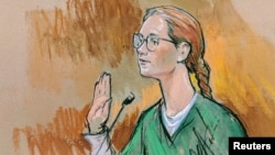 Accused Russian agent Maria Butina pleads guilty to a single conspiracy charge in a deal with prosecutors and admitted to working with a top Russian official to infiltrate a powerful gun-rights group and influence U.S. policy toward Moscow, in Washington, Dec. 13, 2018.