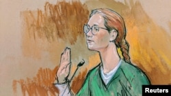 In this courtroom sketch, accused Russian agent Maria Butina pleads guilty to a single conspiracy charge in a deal with prosecutors and admitted to working with a top Russian official to infiltrate a powerful gun-rights group and influence U.S. policy toward Moscow.