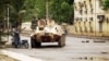 Malian military junta troops who carried out a coup in March guard a street after renewed fighting in the capital Bamako, May 1, 2012. 