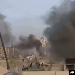 An image grab taken from a video uploaded on YouTube on February 6, 2012 shows what was described as shelling on the Baba Amr district of the restive city of Homs in central Syria.