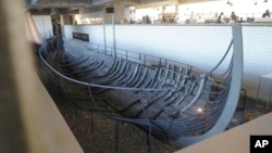 An 11th century, 15-meter Viking ocean-going trading vessel, built in the Nordic clinker boat tradition, sits on display at the Viking Ship Museum. Roskilde, Denmark, Jan. 17, 2022. 