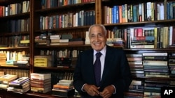 Mohamed Hassanein Heikal, seen in this Sept. 23, 2014 file photo, poses for a picture on his 91st birthday, at his office, in Cairo, Egypt. 