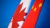 FILE - Flags of Canada and China are placed for the first China-Canada economic and financial strategy dialogue in Beijing, Nov. 12, 2018. 