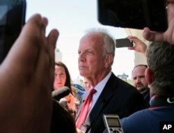 FILE - U.S. Sen. Jerry Moran, R-Kan., speaks to reporters following a town hall meeting, July 6, 2017, in Palco, Kansas.