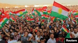 Kurdish people attend a rally to show their support for the upcoming Sept. 25 independence referendum in Duhuk, Iraq, Sept. 16, 2017.