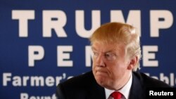 Republican U.S. presidential nominee Donald Trump participates in a roundtable discussion with farmers at a farm market in Boynton Beach, Florida, Oct. 24, 2016. 