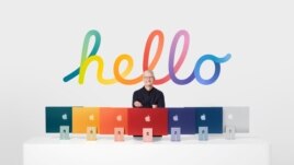 Apple CEO Tim Cook stands with the all-new iMac lineup, in this still image from the keynote video of a special event at Apple Park in Cupertino, California, U.S. released April 20, 2021. Apple Inc./Handout via REUTERS.