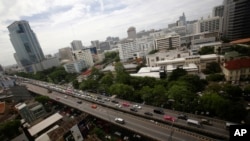FILE - Cars cross the Thai-Japanese friendship bridge in Bangkok, Thailand.