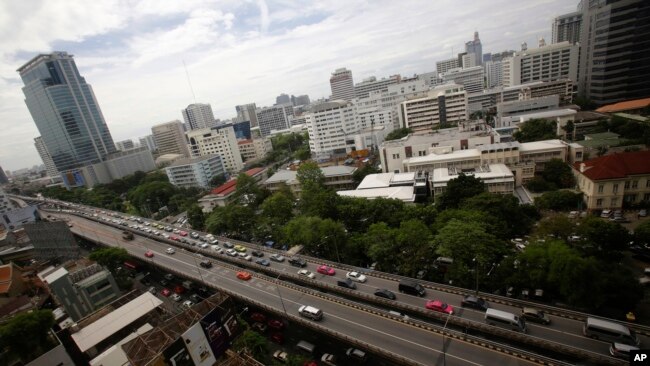 FILE - Cars cross the Thai-Japanese friendship bridge in Bangkok, Thailand.