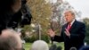 President Donald Trump speaks to members of the media before boarding Marine One on the South Lawn of the White House in Washington, Nov. 26, 2018.