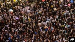 Tens of thousands of people attended the 2013 gathering in Hong Kong to mark the 24th anniversary of the Tiananmen Square crackdown in Beijing, China. (AP Photo/Kin Cheung)