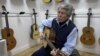 In addition to his successful New York business, Tony Acosta plays the classical guitar. He says his knowledge of music helped him to develop the formula behind his nylon strings, March 2016. (R. Taylor/VOA)