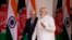 Indian Prime Minister Narendra Modi, foreground, and Afghan President Mohammad Ashraf Ghani walk for a meeting in New Delhi, India, Tuesday, April 28, 2015.