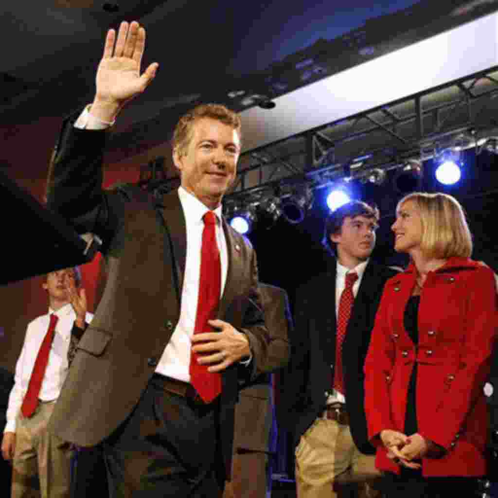 Rand Paul, a favorite of the Tea Party movement, waves to supporters after winning election as a Republican to the Senate from Kentucky