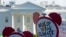 FILE - Protesters gather outside the White House in Washington to protest President Donald Trump's decision to withdraw the United States from the Paris climate change accord, June 1, 2017.