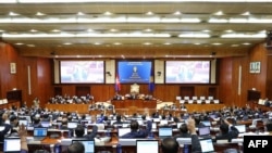 This handout from the Cambodia National Assembly taken and released on June 23, 2023 shows members of parliament attending a meeting at the National Assembly building in Phnom Penh. (Photo by De Ratha / CAMBODIA NATIONAL ASSEMBLY / AFP) / -----EDITORS NOT