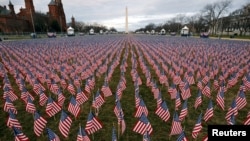Thousands of U.S. flags are seen at the National Mall, as part of a memorial paying tribute to the U.S. citizens who have died from the COVID-19, near the Capitol ahead of President-elect Joe Biden's inauguration, in Washington, D.C.